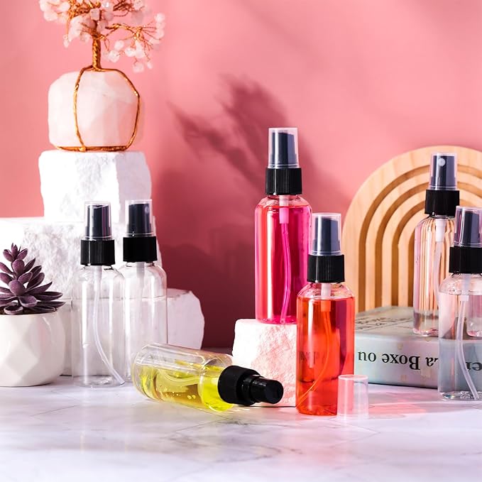 Roshtia 100 Pcs 2 oz Plastic Mini Spray Bottles with Black Cap Clear Empty Fine Mist Spray Bottles Refillable Liquid Container for Essential Oils Perfumes Travel Makeup